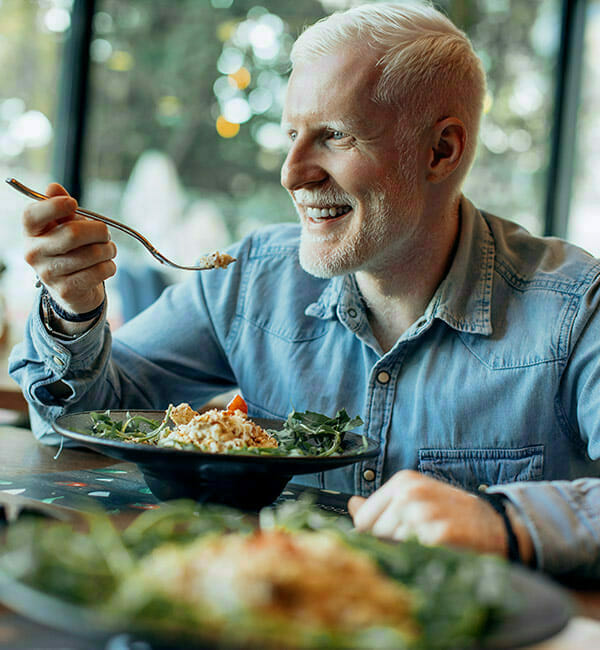 Adobestock 356616237 White haired man eating elegant meal at Chelsea Senior Living