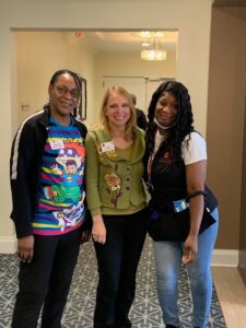 Diane Mandracchia and Staff at Greenburgh Staff smiling at The Chelsea at Greenburgh Assisted Living in Westchester County, NY.