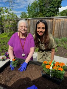 Gardening at The Chelsea at Greenburgh Brittany Gordon with resident at The Chelsea at Greenburgh Assisted Living in Westchester County, NY.