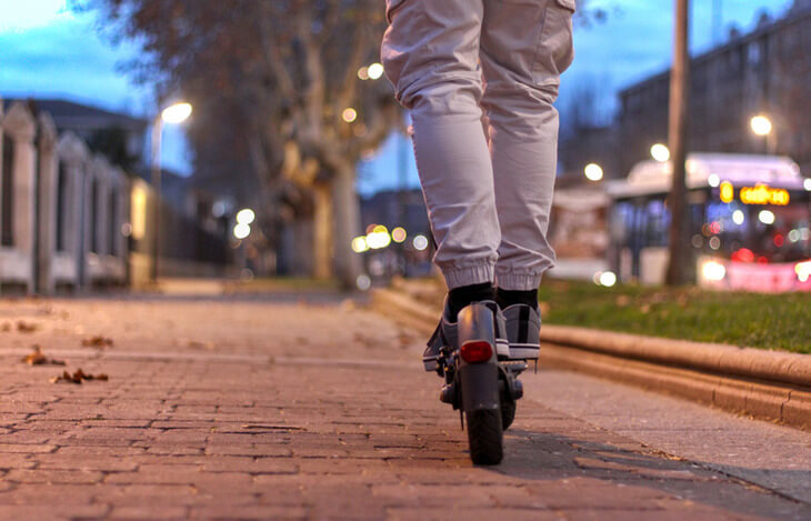 Man riding an electric scooter